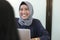 Professional young hijab muslim girl working with laptop, young muslim woman interviewing