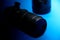 Professional zoom lens for digital SLR digital cameras, isolated on blue background