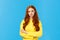 Professionalism, e-commerce and business concept. Serious-looking determined smart gorgeous redhead woman in yellow