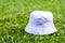 Professionally designed, the mockup displays the elegance of a white blank bucket hat, harmoniously arranged in the midst of