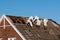 Professionals in protective suits remove asbestos-cement