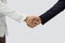 Professionals sealing a deal. Two professional individuals are engaging in a firm handshake. It visualizes mutual agreement or a