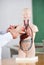 Professor Pointing At Anatomical Model At Desk