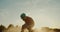 Proffesional sandboarder jumping 180 in desert