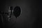 Proffesional studio microphone, isolated on the black background. voice recording