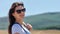 Profile attractive Caucasian young woman enjoying amazing mountain landscape at warm summer day