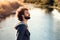 Profile of bearded man on river background