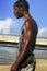 Profile of black man on beach