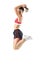 Profile of fit active ecstatic young sportswoman jumping in mid air frozen motion