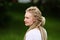 Profile girl with an unusual hairstyle, white dreadlocks, close-up