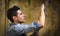 Profile of handsome young man in abandoned building