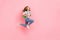 Profile photo of active carefree lady jump rush back to school wear bag jacket isolated pink color background