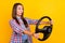 Profile photo of amazed surprised driver lady hold steering ride fast hurry wear plaid shirt isolated yellow color