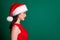Profile photo of attractive charming lady look empty space good mood magic miracle atmosphere wear santa cap red dress