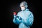 Profile photo of guy doc virologist hold telephone chatting patients online wear gloves respirator mask hazmat blue