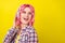 Profile photo of impressed pink hairdo millennial lady hear music look wear plaid shirt isolated on yellow color