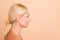 Profile photo of natural beauty aged lady look side empty space spa procedure isolated pastel beige color background