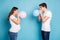 Profile photo of optimistic pregnant couple blow balloons wear white t-shirt jeans isolated on teal color background