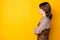 Profile photo of sad brunette lady arms crossed wear brown shirt isolated on vivid yellow color background