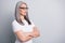Profile photo of senior old woman look empty space wear specs white t-shirt isolated grey color background