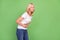 Profile photo of sick blond aged lady hold belly wear white t-shirt isolated on pastel green color background