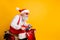 Profile photo of stylish santa white hair grandpa riding speed x-mas theme party by bike wear trendy sun specs red