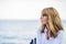 Profile portait of middle aged woman relaxing by the sea