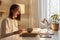 Profile portrait of angry tired woman with brown hair sitting at table working on laptop in evening at home, working long hours,