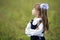 Profile portrait of cute adorable first grader girl in school un