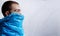 Profile portrait of a guy have covered mouth with blue plastic bag, shot in studio. copy space. Environmental content.