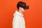 Profile portrait of happy young man in casual style hoodie enjoying view in virtual reality glasses, modern technologies