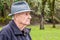 Profile Portrait of Serious Older Man with Grey Tweed Rain Hat a