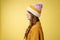 Profile shot attractive female curly hairstyle wearing hat knitted sweater standing queue order hot warm drink look left