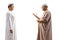 Profile shot of a father and son in islamic ethnic clothes having a conversation