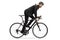 Profile shot of a man in a suit riding a bicycle to work