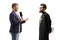 Profile shot of a reporter with a microphone talking to a catholic priest