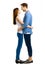 Profile side image of smiling happy couple. Full body of standing close and looking at each other models in love. Isolated