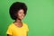 Profile side photo of afro american nice woman look empty space good mood smile isolated on green color background
