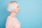 Profile side photo of concentrated woman looking staring wearing pastel pullover isolated over blue background