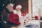 Profile side photo excited grey hair santa claus sit table impressed get wish list letter x-mas miracle fair christmas