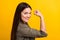 Profile side photo of happy nice positive young woman raise fist flex muscle isolated on yellow color background