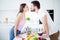 Profile side photo of two people gentle tender couple soulmate prepare 14-february dish lunch salad nutrition kiss enjoy