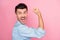 Profile side photo of victorious happy cheerful guy raise fist strong scream isolated on pastel pink color background