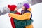 Profile side photo of young cheerful couple happy positive smile cuddle love romance vacation snowy weather outside