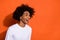 Profile side photo of young guy laughing humorous look empty space isolated over orange color background