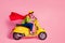 Profile side view of his he nice attractive cheerful cheery purposeful guy driving moped fast wearing cape mantle