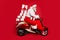 Profile side view of nice bearded focused funky fat Santa riding moped pile stack winter fairy purchases isolated on