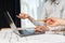 Profile side view photo of cropped two cooperation professional designer person in formal wear sit at the desk in bright loft