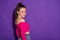 Profile side view portrait of gorgeous busty cheerful girl copy wearing fuchsia crop top space isolated bright violet