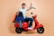 Profile side view portrait of nice cheerful guy sitting on moped carrying diving tools ocean destination isolated over